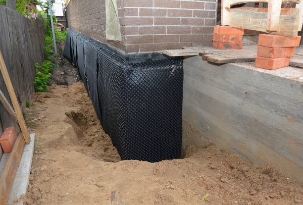SJ Waterproofing Pros technician performing targeted Waterproofing assessment in Medina, MN